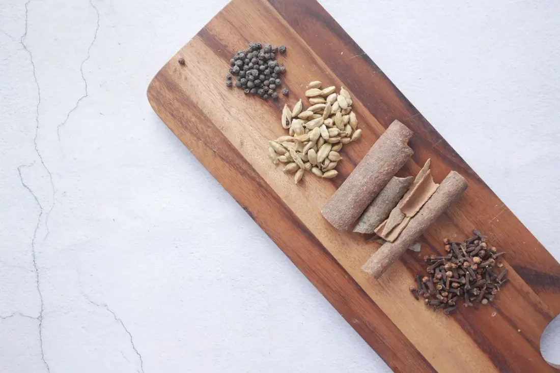 AroWest's range of Western Ghats spices arranged on a wooden board